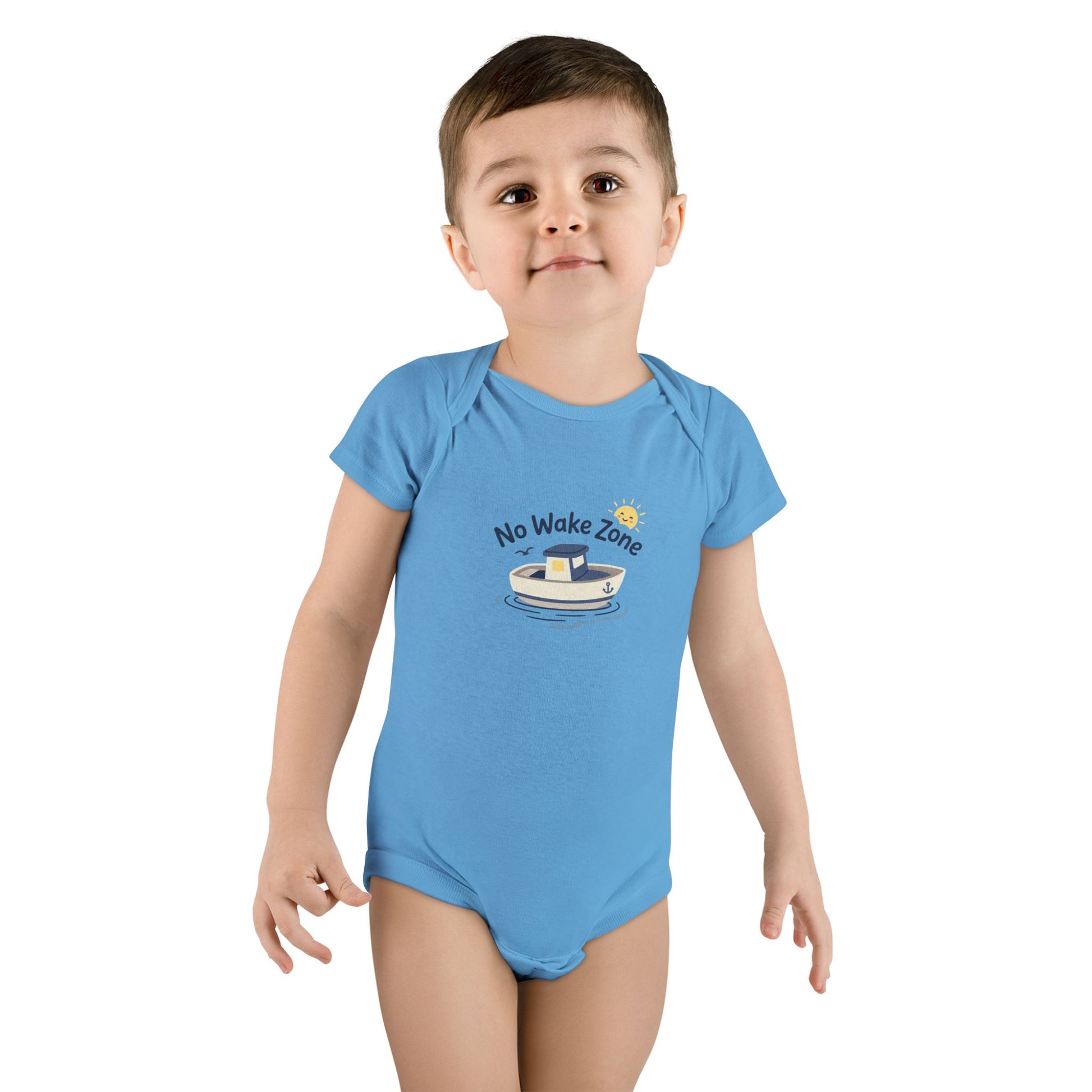 Toddler girl wearing blue No Wake Zone Onesie with nautical boat graphic