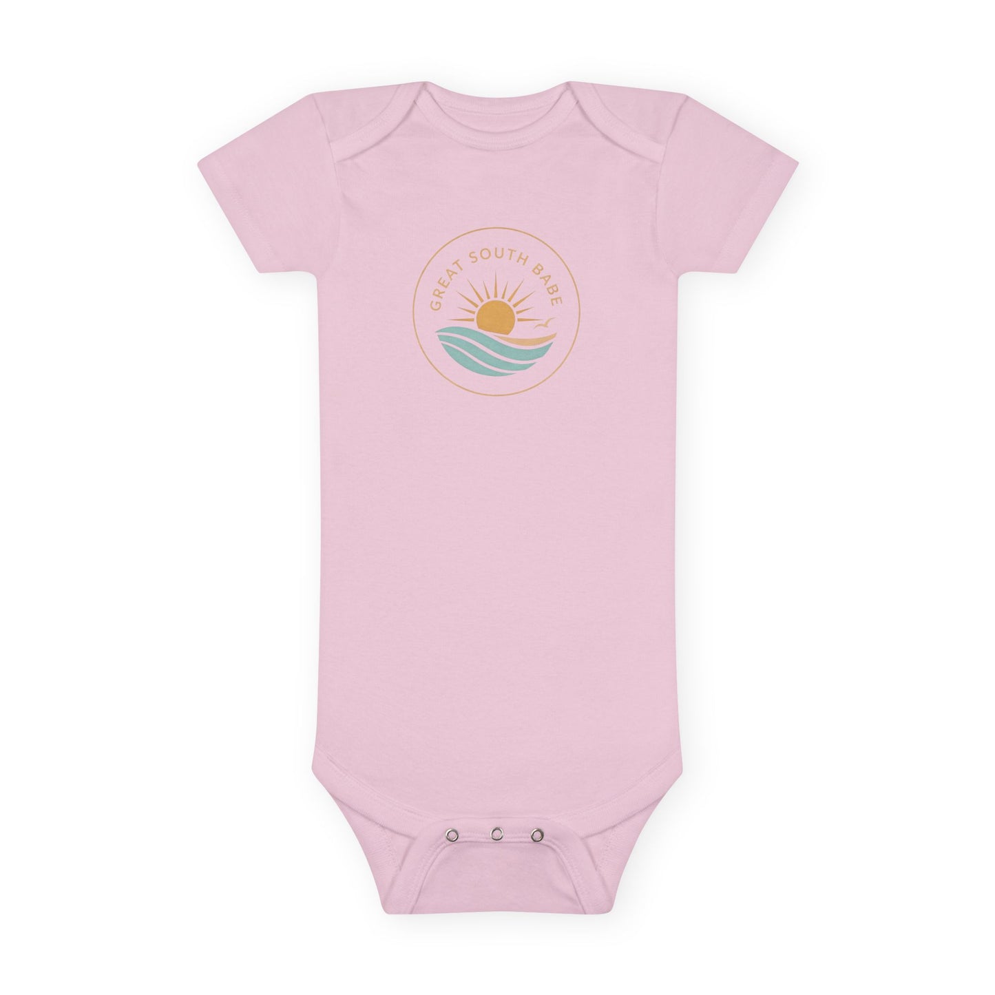 Great South Babe onesie in light pink with sun and waves logo, flat lay