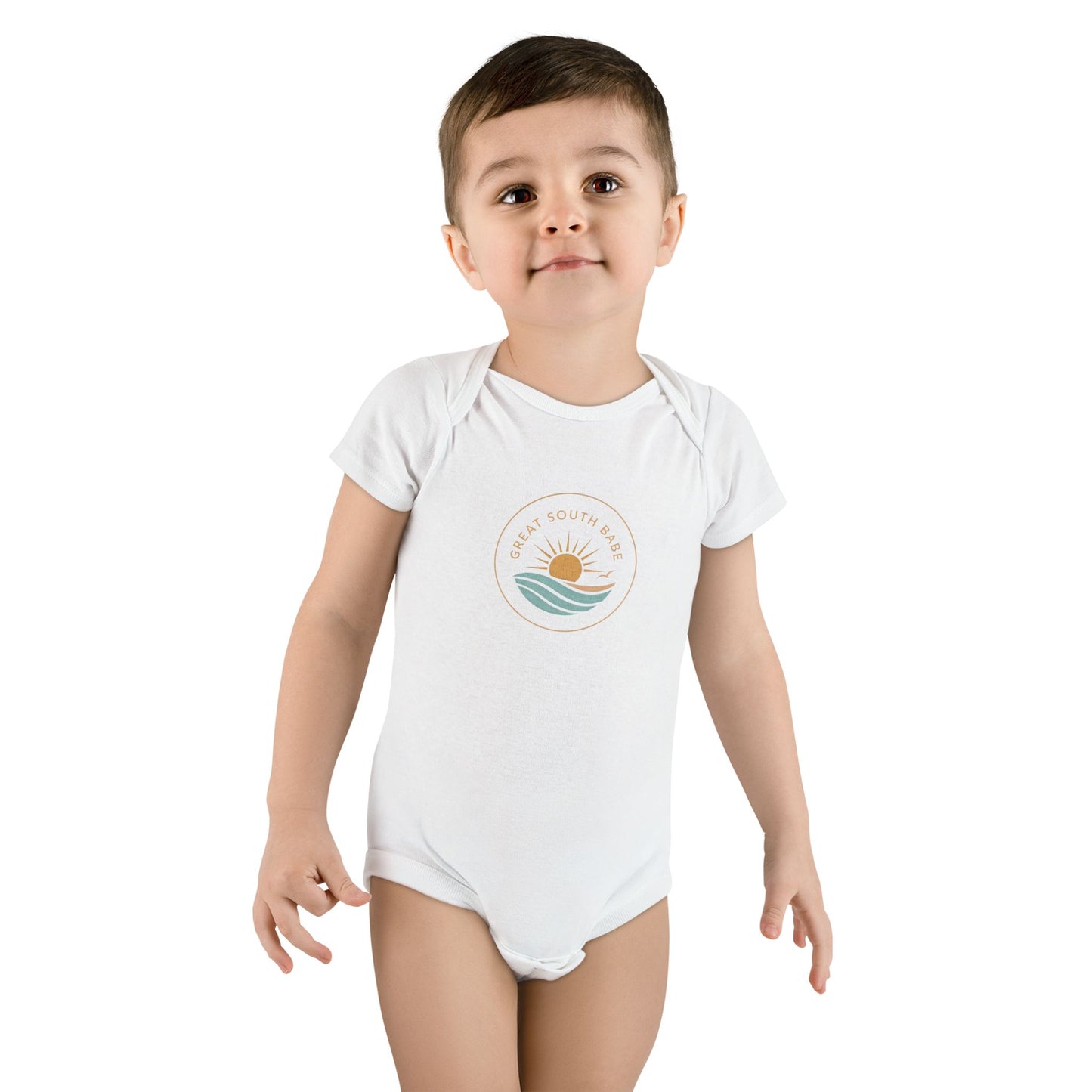Toddler boy wearing white Great South Babe onesie with sun and waves logo