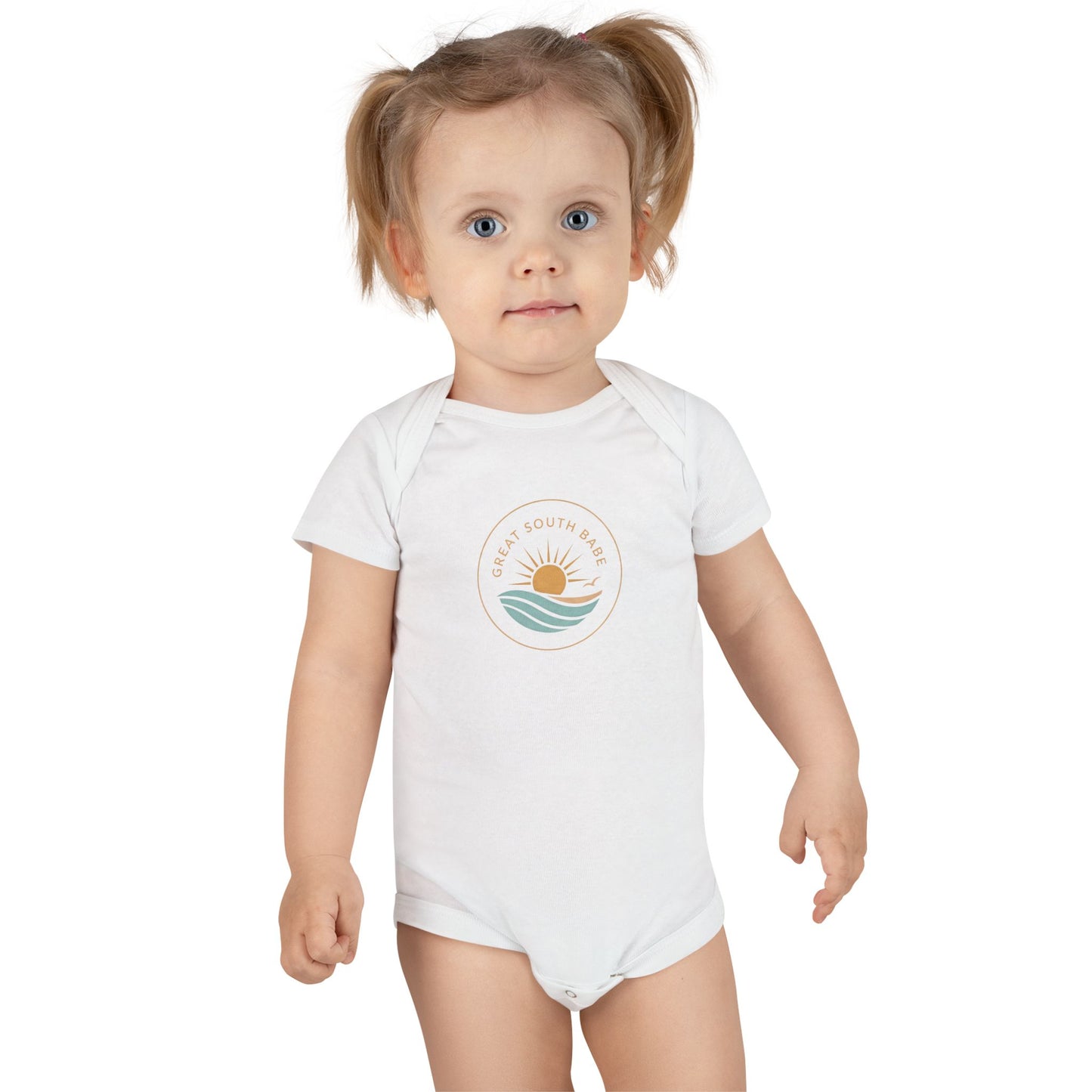 Toddler girl wearing white Great South Babe onesie with sun and waves logo