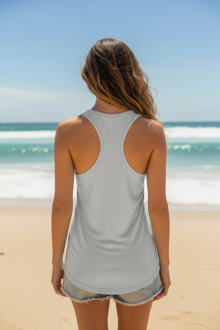 Woman wearing athletic heather grey Great South Babe tank top, back view on the beach